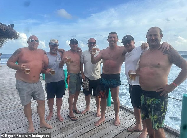 Fletcher (pictured third from right on a previous tropical vacation) ended up getting stitches in his foot from a drunk surgeon.