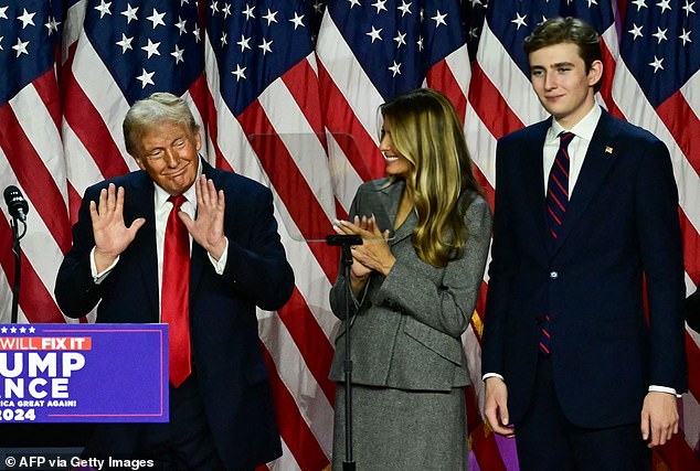 Barron, right, is seen towering over his parents, pictured as Donald Trump celebrated his historic victory on election night earlier this month.