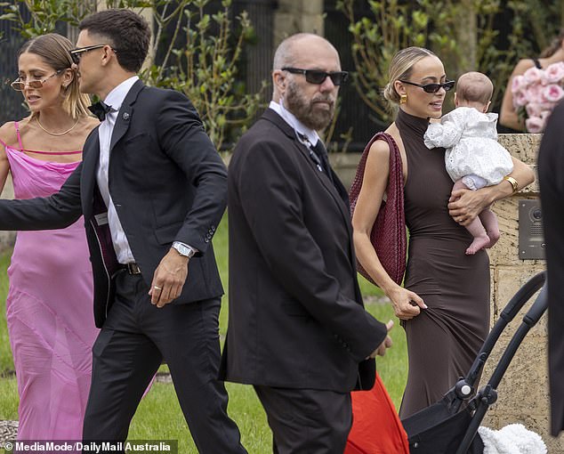 The Perth influencer, 30, was seen cradling her three-month-old daughter Isla as she celebrated Tammy marrying her Love Island Australia partner Matt Zukowski at Chateau Du Soleil.