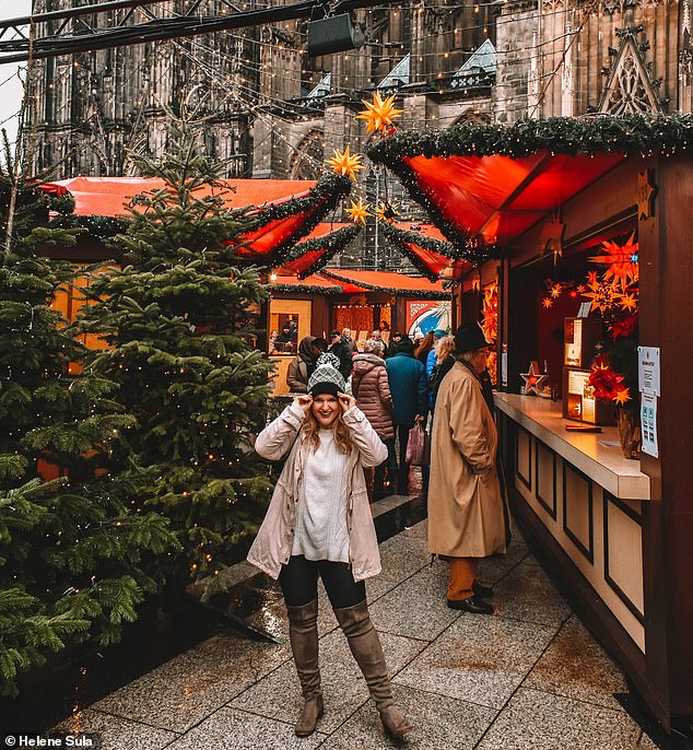 Helene appears at the Cologne Christmas market, where the cathedral creates the 