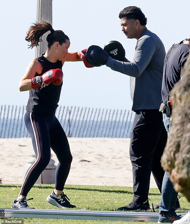 The 52-year-old actress wore a black tank top, navy leggings and red boxing gloves while filming near the beach.