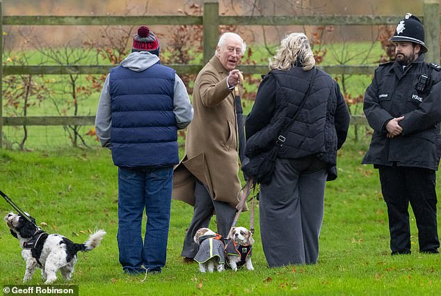 Arriving for the service, King Charles stopped to chat to a couple of dog walkers passing by the Grade II listed parish church.