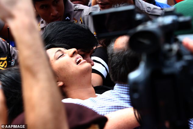 The heartbreaking screams of the relatives of the nine Bali ringleaders sentenced to death will always remain with me. Above, scenes in the port the afternoon before his execution.