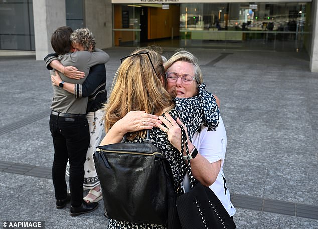 Griffiths' mother Bernie is seen hugging members of her family outside the Queensland Supreme Court on Monday. He said his family has not received closure or justice.