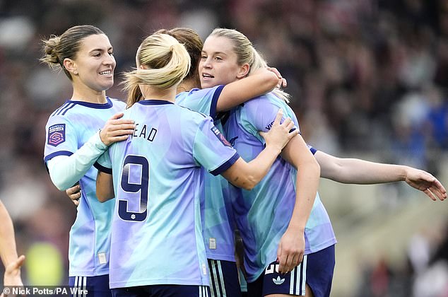 Russo celebrates with her teammates Sunday's goal against her former club