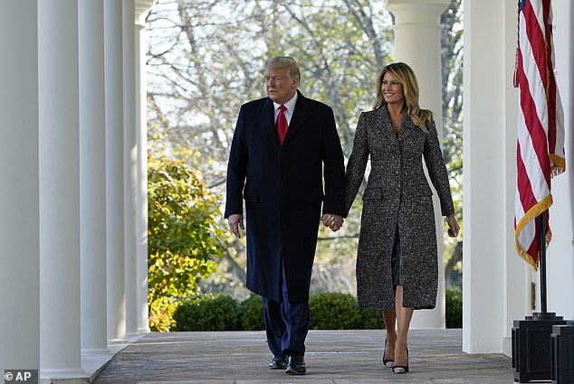 President Donald Trump and first lady Melania Trump exit the Oval Office toward the Rose Garden of the White House in November 2020.