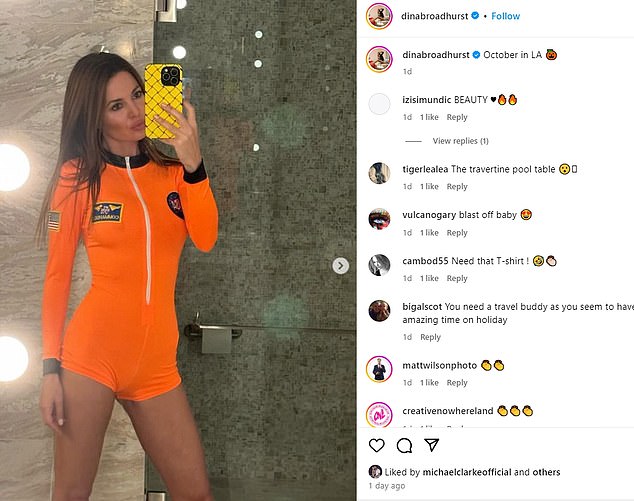 The cricketer placed a love heart under a selfie of Dina flaunting her incredible figure in a bold orange NASA astronaut suit.