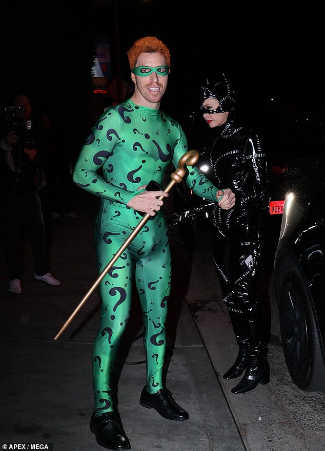 While the 38-year-old Olympic snowboard champion wore a green jumpsuit, red hair and a golden cane.