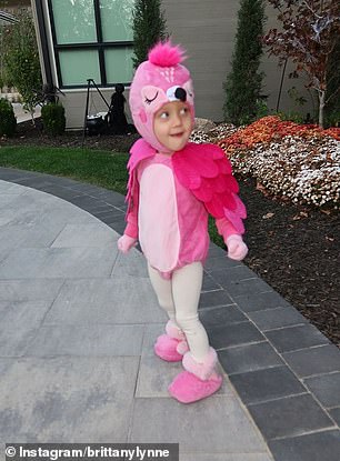 Three-year-old Sterling was all smiles as she got ready to trick-or-treat in her pink flamingo costume.