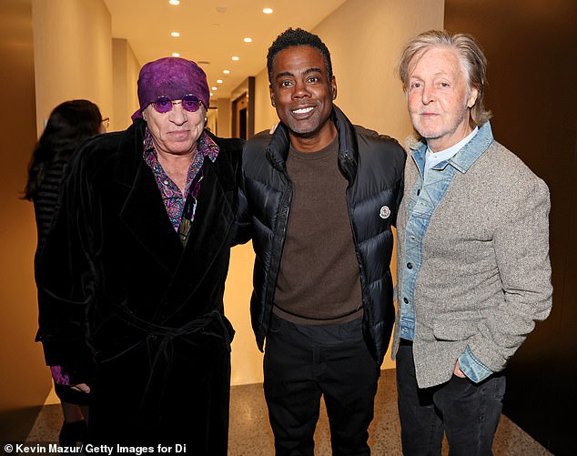 Later, inside the venue, McCartney posed for a photo with Steven Van Zandt and Chris Rock.