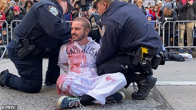 The protest focused on US support for Israel, while also linking the Middle East crisis to climate change, chanting: 'Liberation for Palestine and climate'.