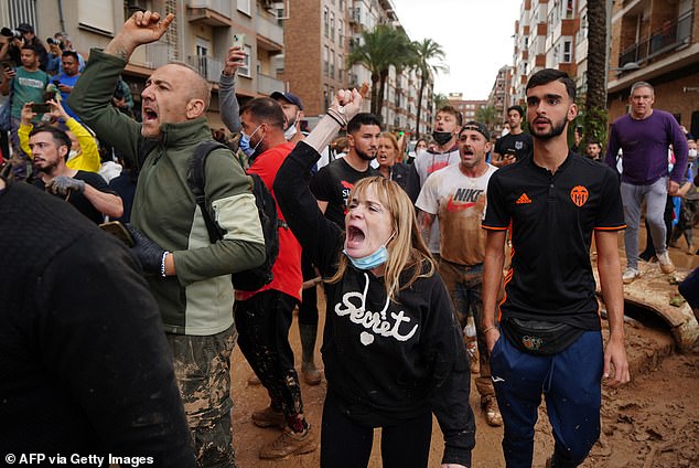 Angry residents of Paiporta shout during the visit of King Felipe and Queen Letizia of Spain to the city.