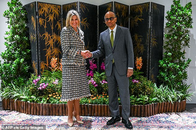 The Dutch royal gave a speech as part of her role as the United Nations Secretary-General's Special Advocate for Financial Health (UNSGSA) before meeting Singapore President Tharman Shanmugaratnam (pictured right).