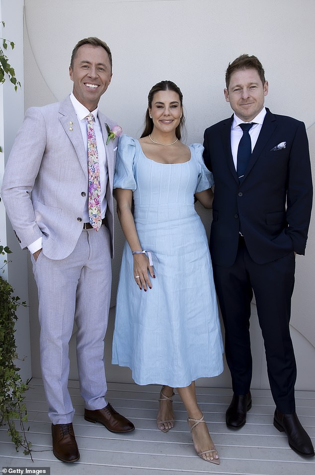 Lauren donned a linen dress with puffed sleeves that fell to her ankles and cinched her waist. Sge posed with his radio colleagues Jason 'Jase' Hawkins and Clint Stanaway