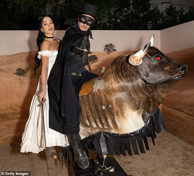 Rita and her husband Taika Waititi rode a mechanical bull at Vas J Morgan and Michael Braun's star-studded Halloween party in West Hollywood last week.