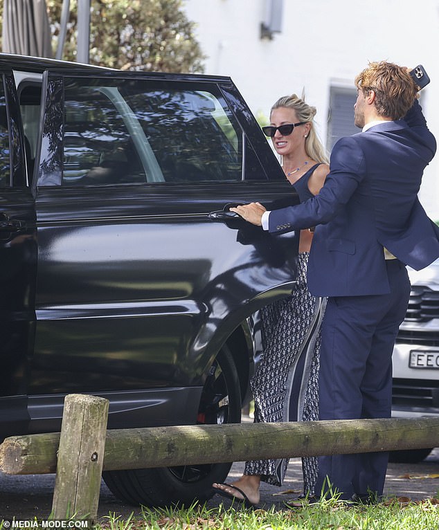 The PR Queen tied her blonde hair up and held a small wallet as she walked to a car waiting for her after lunch.