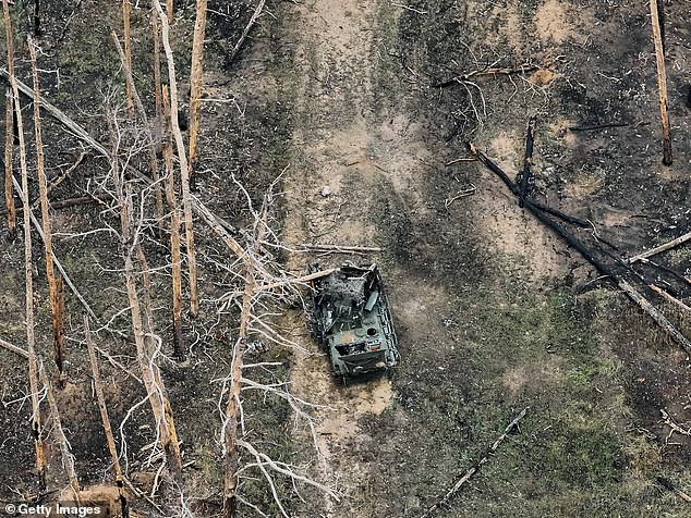 A view from a drone showing a destroyed Russian armored vehicle in part of a forest where the hottest phase of the war takes place on November 9, 2024. The forest is located about 8 kilometers southwest of Kreminna in the Oblast of Luhansk, Ukraine