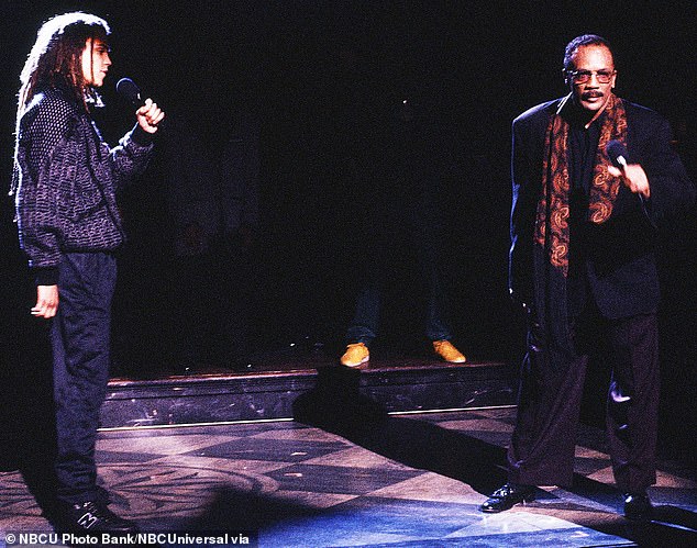 Quincy hosted the show once in 1990 and decided to invite 10 musical guests with him, a record for the show; photographed in the series with his son Quincy D III (left)