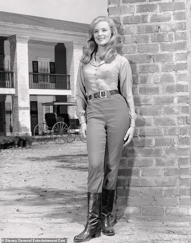 Evans is seen here on the set of the western show The Big Valley. She played the stunning Audra Barkley, the daughter of Victoria Barkley (played by Barbara Stanwyck).