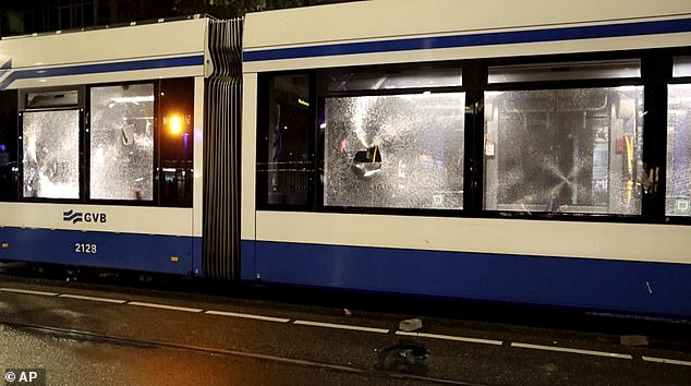 Amsterdam tram damaged after people armed with sticks and firecrackers set it on fire