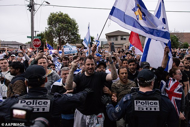 Pro-Israel activists gathered outside the Caulfield Hebrew Congregation on Monday night following reports of a pro-Palestinian protest, which was called off at 11am.