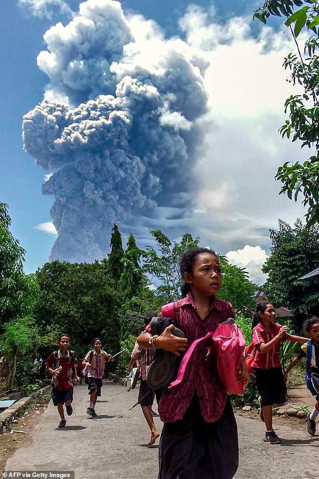 Locals near the volcano reported multiple tremors at the time of the eruption, which sent columns of ash between 500 and 2000 m into the sky after the eruption (pictured).