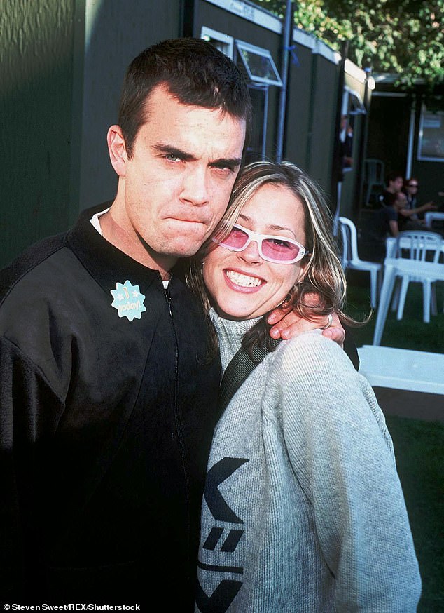 The All Saints star showed her support for the film, which covers her tumultuous '90s romance with Robbie (Nicole and Robbie pictured in 1998).