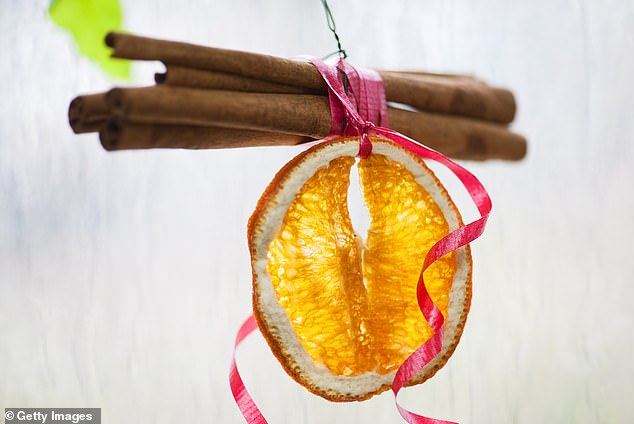 Oranges and cinnamon sticks evoke the spirit of Christmas without artificial flavors