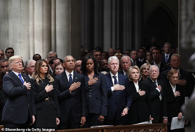 Jill Biden (behind Jimmy Carter on the right) and Melania Trump (second left) photographed together at the funeral of former US first lady Rosalynn Carter in November last year.