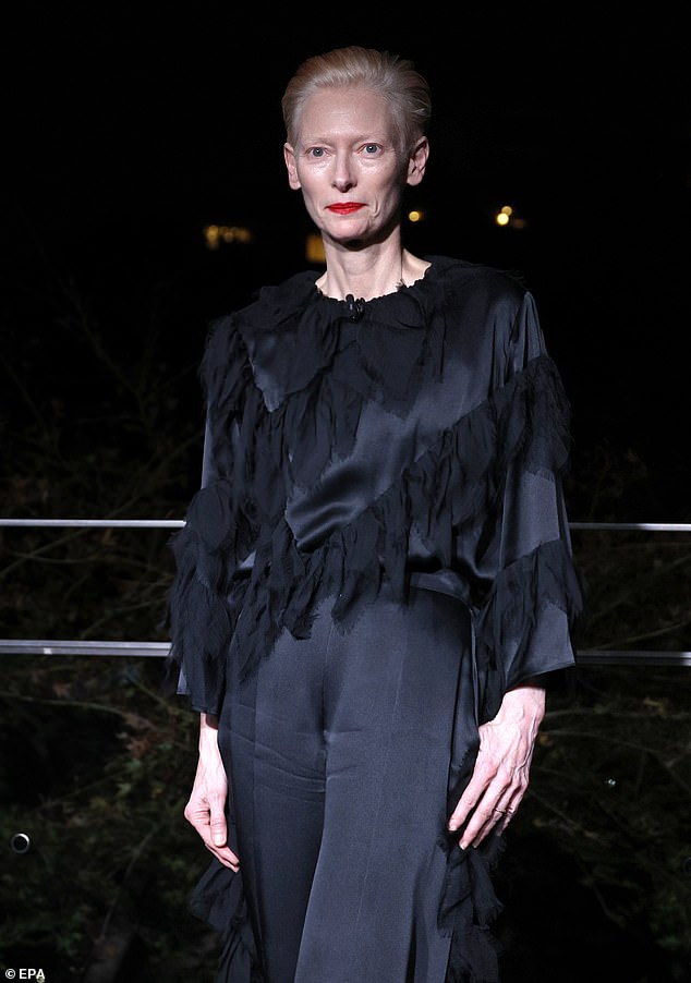 The 64-year-old actress, an ambassador for the fashion brand, looked incredible in a black satin ensemble with tulle details.