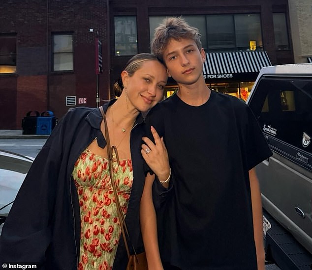 The mother of two also included a shot with her and Tobey's 15-year-old son, Otis. In it, he clung to the teen's arm while resting his head on his shoulder.