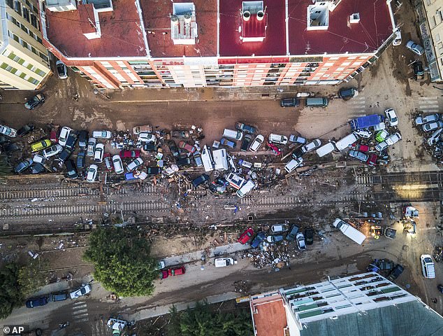 Vehicles pile up in the streets caused by the storm late on Tuesday and early on Wednesday that left hundreds dead or missing in Alfafar, Valencia.