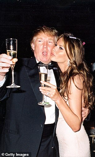 Trump and his then-future wife Melania raising their glasses for a New Year's toast at the Mar-a-Lago estate, Palm Beach, Florida, January 1, 2004.