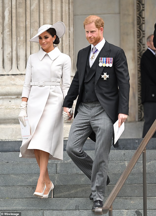 The Duke of Sussex's visa application was questioned after he admitted in his 2023 memoir to having used several drugs recreationally, which he would have been required to disclose in immigration documents. He is photographed with his wife Meghan Markle in London in 2022.