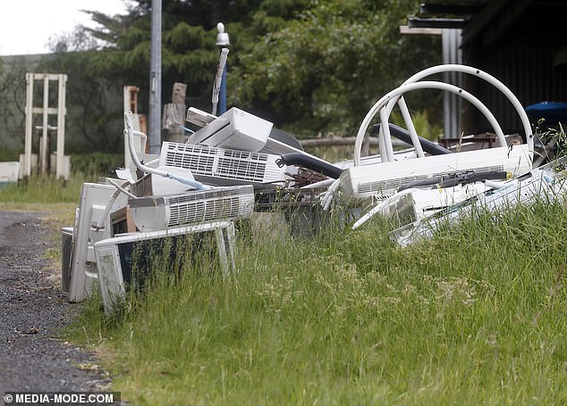 A pile of trash has appeared outside Robinson's home since September, when the court issued a 60-day deadline.