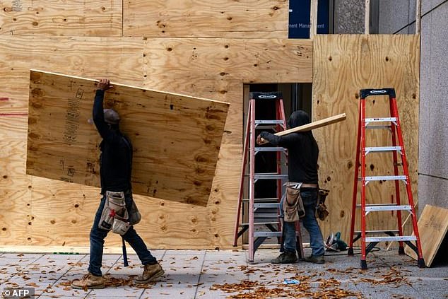 Storefronts and buildings are boarded up along Pennsylvania Avenue near the White House.