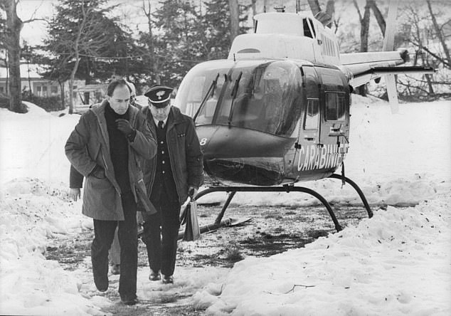 Stephen May disembarks from a helicopter after searching for his missing wife Jeanette