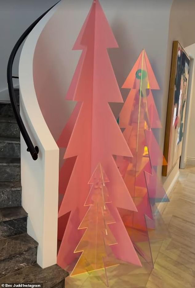 The large 2.1 meter pink cutout sells for $1,550, while the 1.5 meter clear acrylic tree sells for $1,250 and its 80cm tree costs $300.