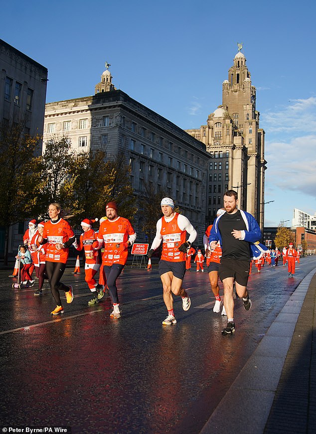 Pictured today: Kevin begins his latest fundraising challenge, Running Home For Christmas, at the annual Liverpool Santa Dash charity fundraising event.