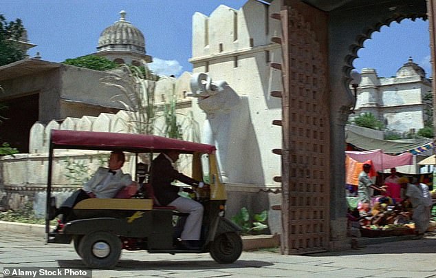 Roger Moore is seen entering the palace in a golf cart in Octopussy