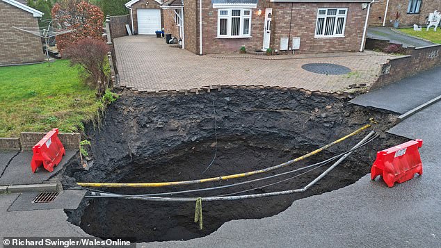 The public has been urged to stay away from the 60-foot hole in the ground.