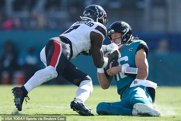 The cleats are seen on Al-Shaair's feet as he collides with Jaguars QB Trevor Lawrence