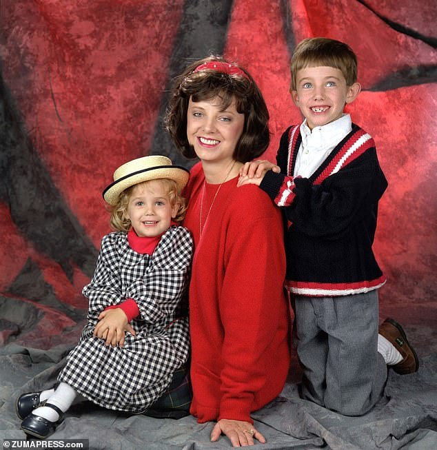 JonBenét is pictured with her mother Patsy and brother Burke Ramsey in 1990