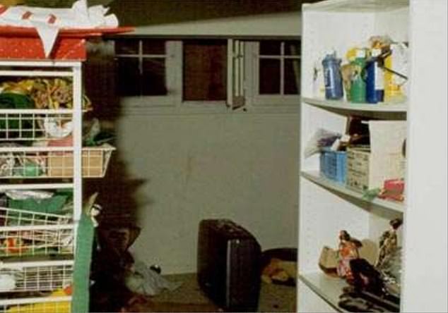 A crime scene photo at the Ramsey family home showed the open basement window that investigators believe JonBenét's killer used. Her body was found under a blanket in an adjacent room used as a wine cellar