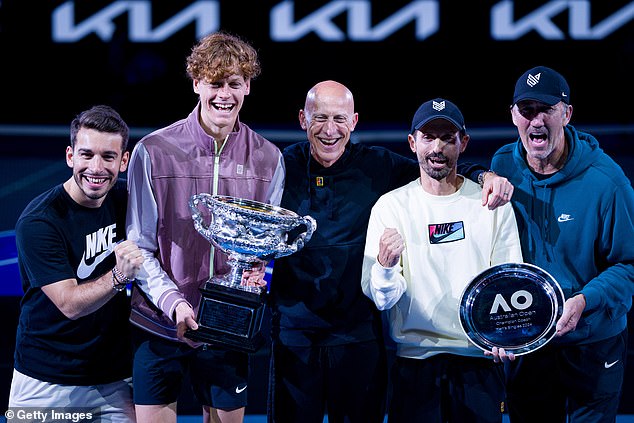 Physio Giacomo Naldi (left) and fitness coach Umberto Ferrara (right) pictured with Sinner (centre) after the tennis star won the 2024 Australian Open in January.