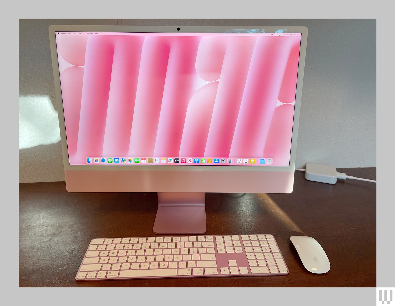 Front view of Apple iMac M4 2024 slim pink desktop computer with matching keyboard and flat white mouse