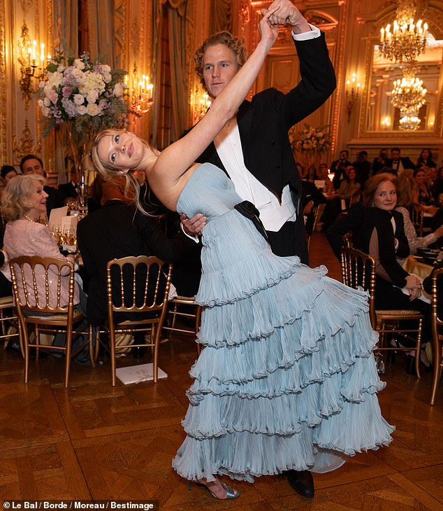 Later, the couple took their positions on the dance floor and gracefully waltzed around the room with Leo carefully dipping Apple.