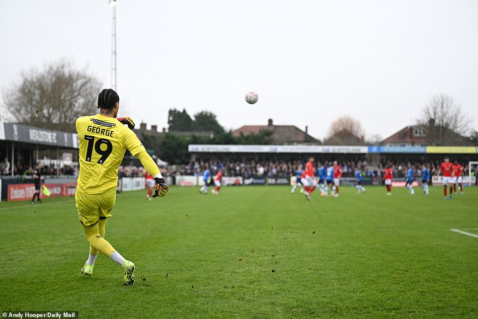 Wycombe Wanderers' 26-year-old goalkeeper Shamal George clears his lines from outside his area during the FA Cup tie