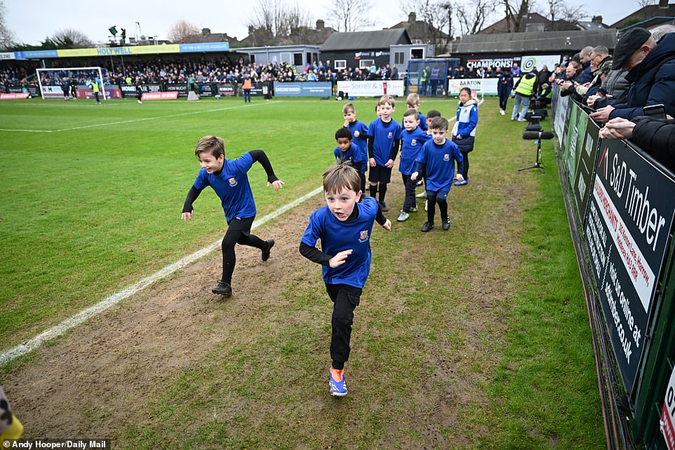 A few lucky youngsters supporting Wealdstone had the chance to run to the touchline on a memorable FA Cup afternoon.