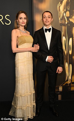 Angelina Jolie poses on the red carpet with her son Knox Jolie-Pitt, 16, on November 17.